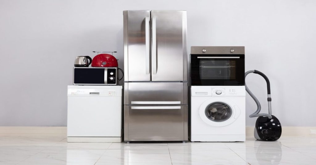 A range of household appliances including a refrigerator, washing machine, microwave, and vacuum cleaner, representing domestic life and modern home electronics